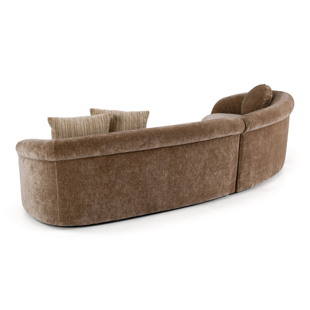 Curved Chiara sofa with plush fabric, modern design, and neutral color, perfect for stylish living room seating.