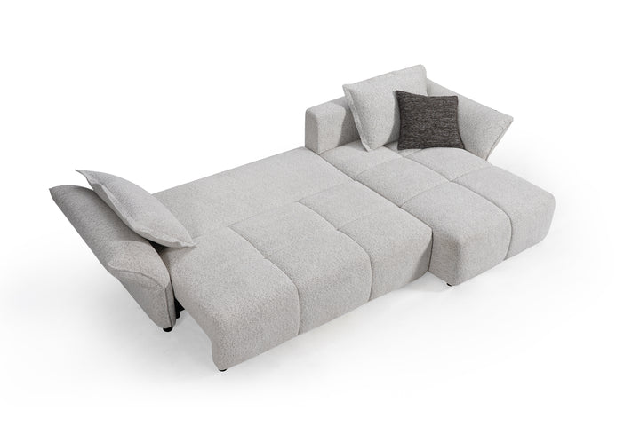 Comfortable beige Serenity sofa with plush cushions and modern design, perfect for living room relaxation.