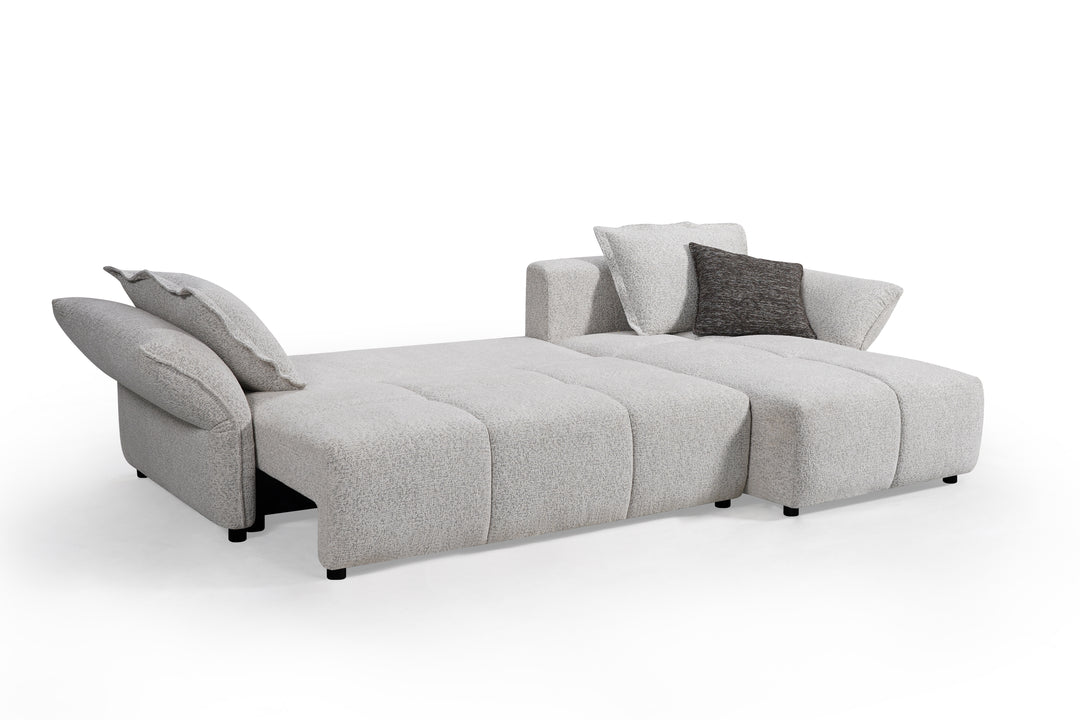 Comfortable beige Serenity sofa with plush cushions and modern design, perfect for living room relaxation.