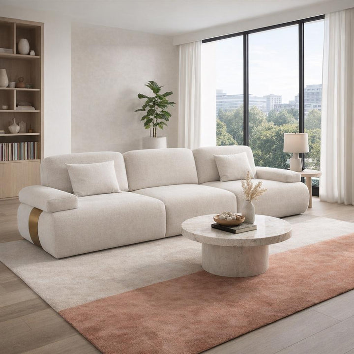 Three-seater sofa from Status, showcasing a modern design with plush cushions and sleek upholstery.