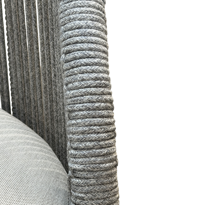 Gray Jardin outdoor arm chair with a cushioned seat and armrests, designed for comfortable outdoor lounging.