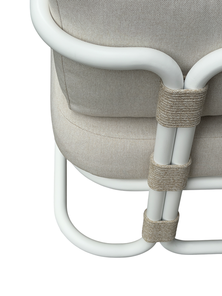 Cream-colored Fiore outdoor arm chair, stylish occasional chair with a cushioned seat and armrests, suitable for patio or garden.
