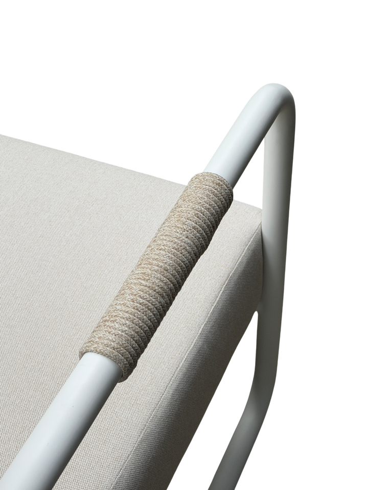 Cream Fiore outdoor arm chair with cushioned seat and armrests, designed for outdoor lounging and relaxation.