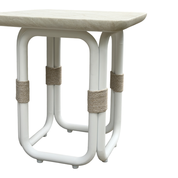 Cream Fiore side table with a sleek, modern design, featuring a round top and slender legs for contemporary home decor.