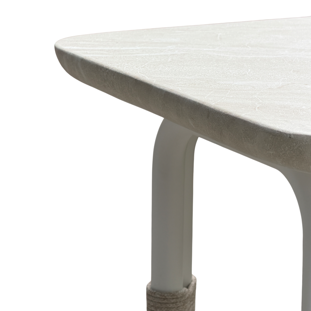 Cream-colored Fiore side table with a sleek, modern design, featuring a smooth surface and minimalist legs.