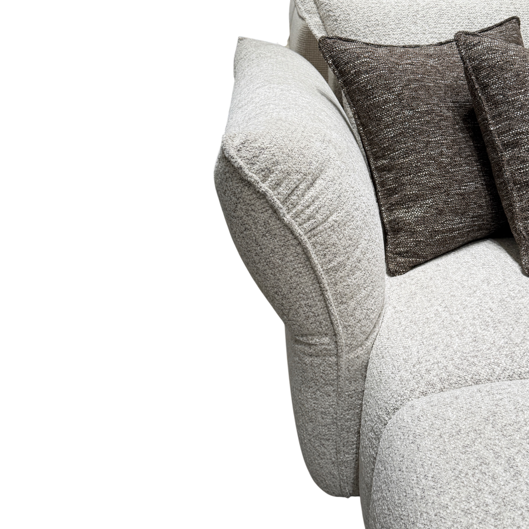 Comfortable Serenity sofa in neutral fabric, featuring plush cushions and modern design for stylish living room seating.