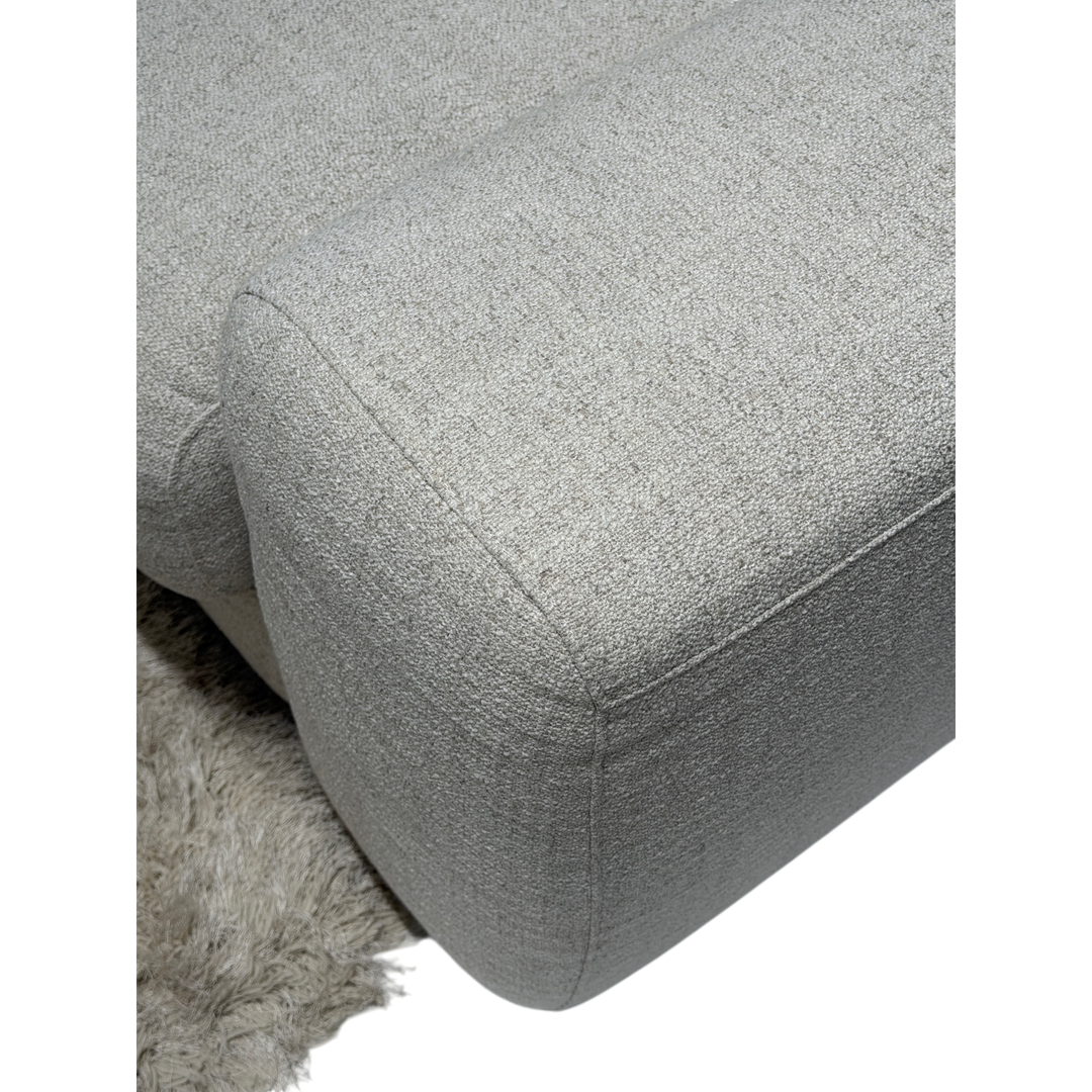 Corner sofa with plush fabric in a cozy, modern design, featuring a right-hand facing configuration.