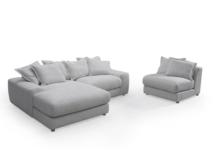 Corner sofa by Snuggy, LHF model, featuring plush fabric and modern design, shown in a cozy living room setting.