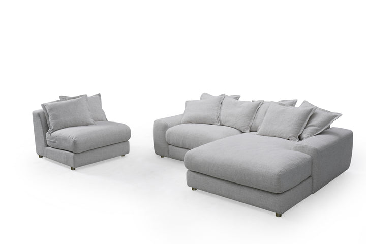 Corner sofa in a neutral fabric with plush cushions, featuring a right-hand facing design for a stylish and comfortable living room.