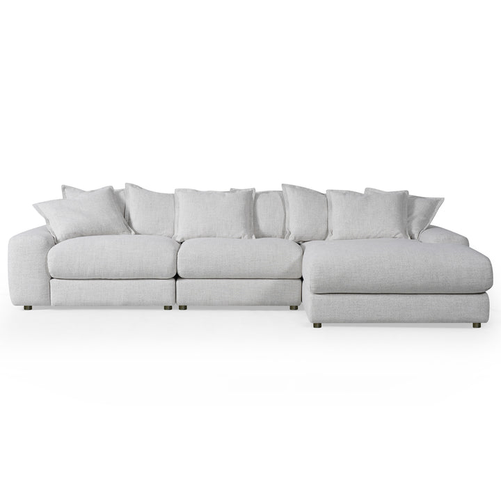 Corner sofa in neutral fabric, featuring plush cushions and a right-hand facing design, ideal for modern living rooms.