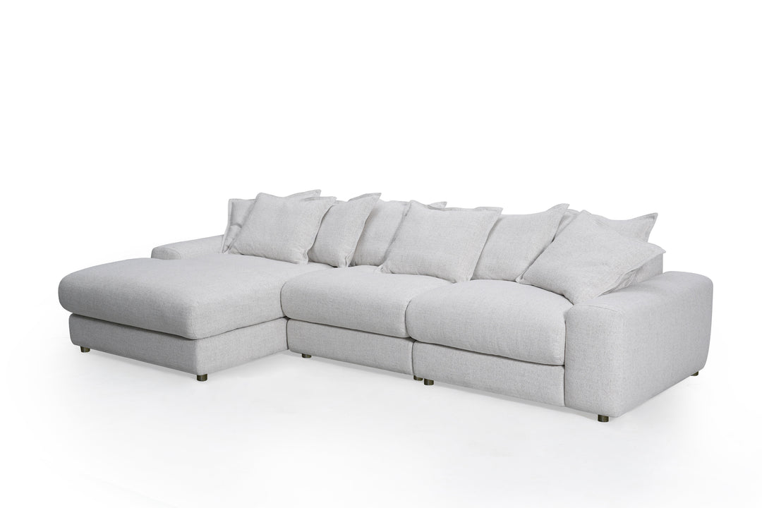Corner sofa in beige fabric with plush cushions, Snuggy LHF sofa with modern design and wooden legs.
