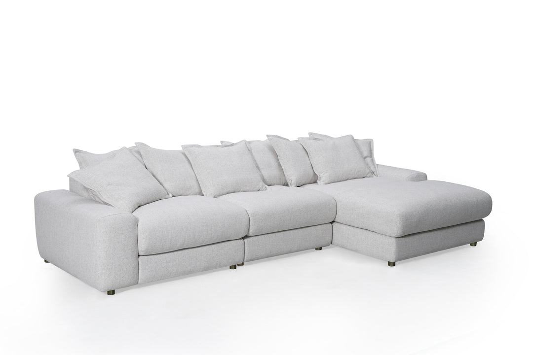 Corner sofa in beige fabric with plush cushions, right-hand facing, modern design, ideal for living room seating.