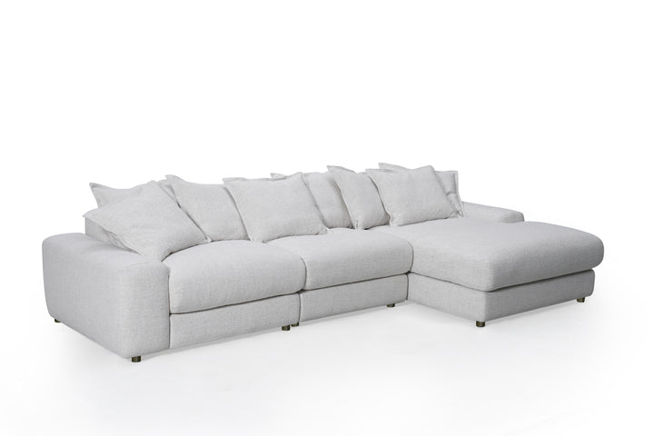 Corner sofa in beige fabric with plush cushions, right-hand facing, modern design, ideal for living room seating.