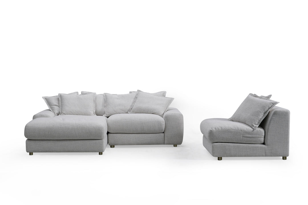 Corner sofa with plush cushions and modern design, featuring left-hand facing configuration in a cozy living room setting.