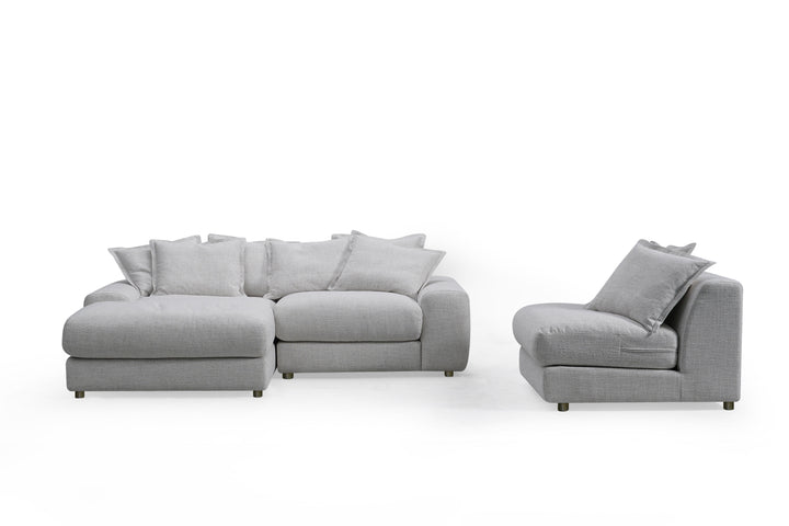 Corner sofa with plush cushions and modern design, featuring left-hand facing configuration in a cozy living room setting.