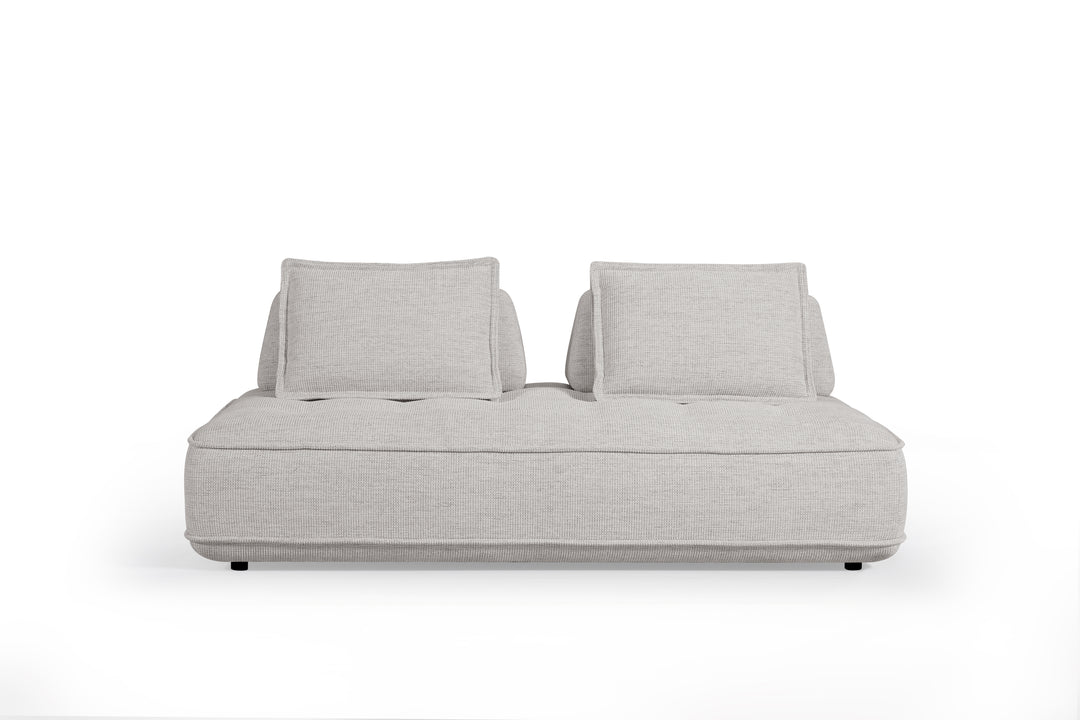 Cozy modular sofa in neutral fabric with plush cushions and adjustable sections, ideal for modern living room seating.