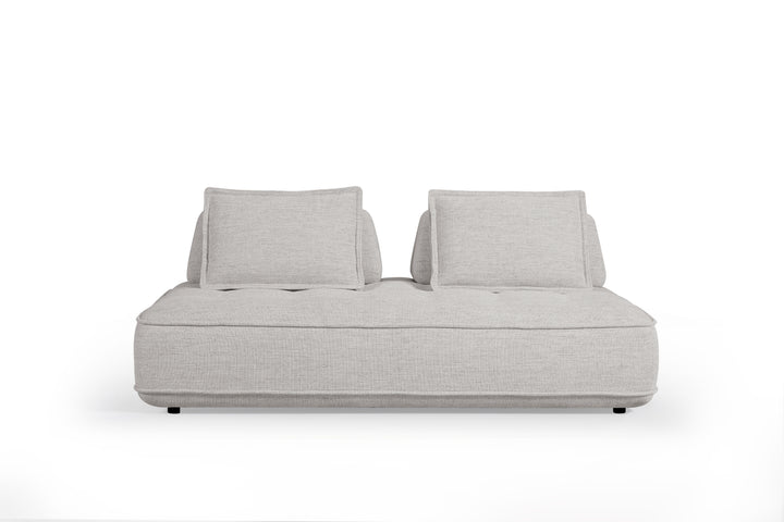Cozy modular sofa in neutral fabric with plush cushions and adjustable sections, ideal for modern living room seating.