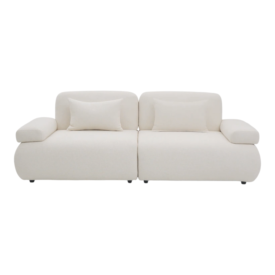 Two-seater sofa from the Status collection, featuring a modern design with plush cushions and stylish fabric upholstery.