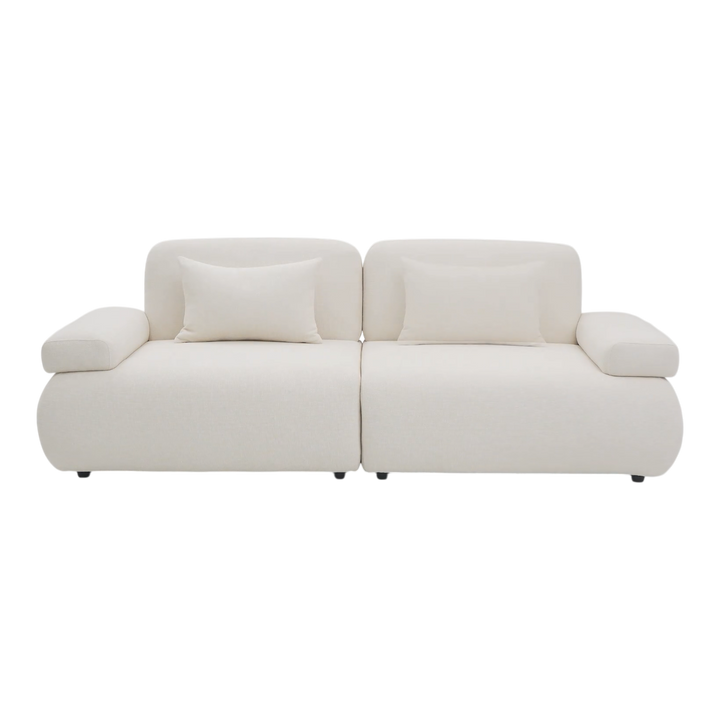 Two-seater sofa from the Status collection, featuring a modern design with plush cushions and stylish fabric upholstery.