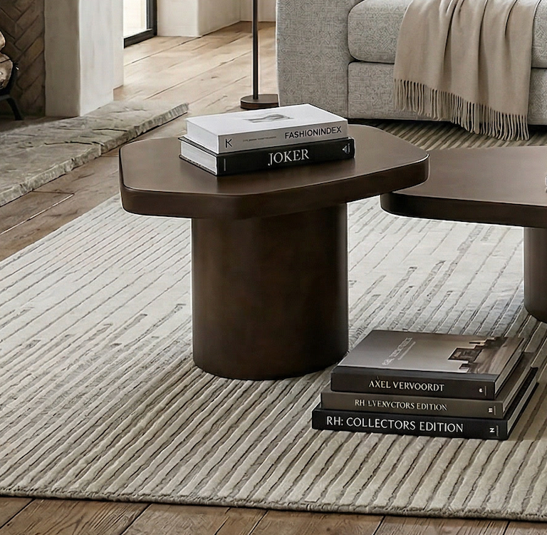 Light wood Liguria side table with a round top and four slender legs, ideal for living room or bedroom decor.