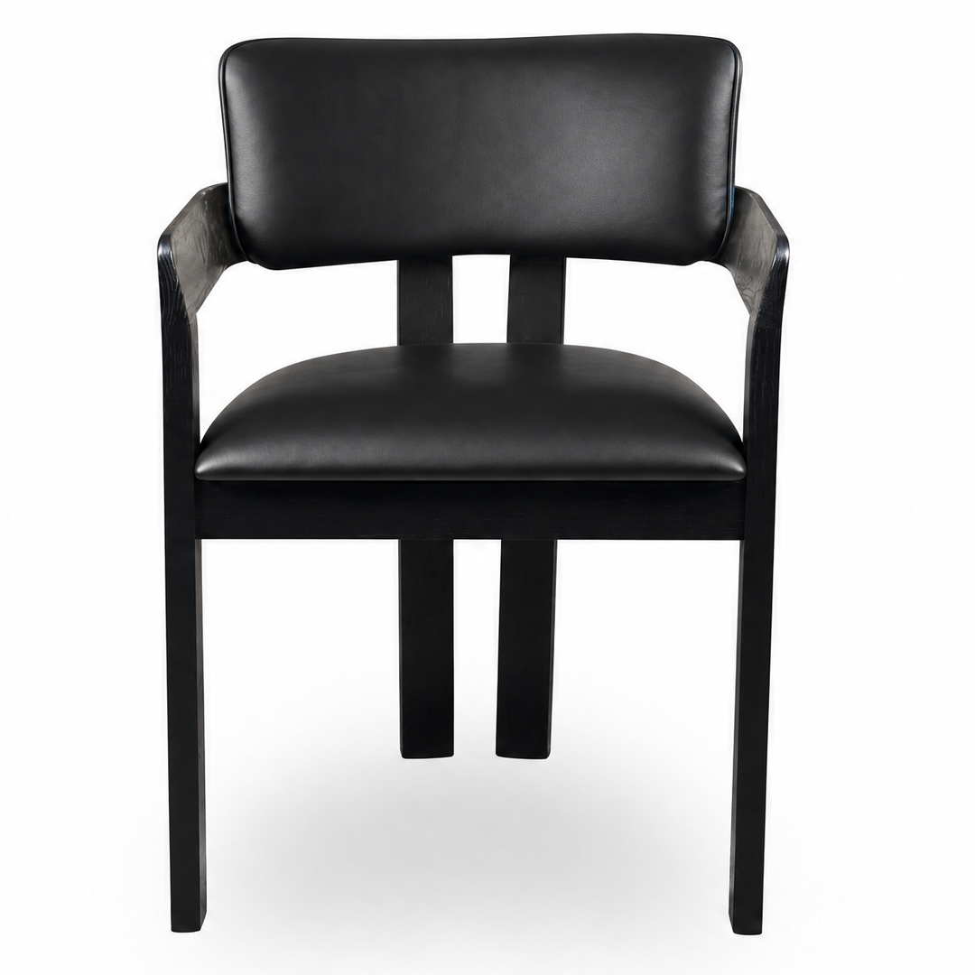 Black leather Maison dining chair with sleek, modern design, featuring a comfortable cushioned seat and stylish wooden legs.