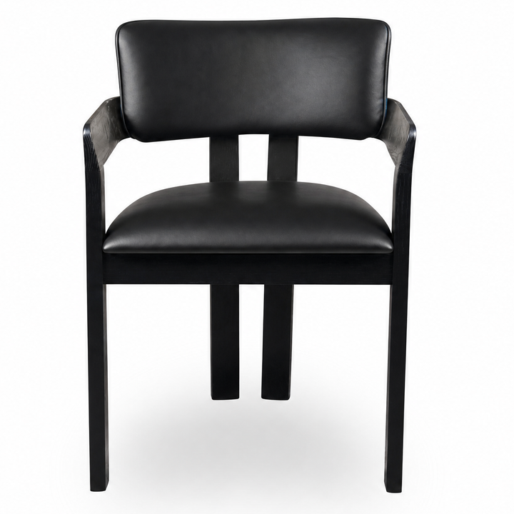 Black leather Maison dining chair with sleek, modern design, featuring a comfortable cushioned seat and stylish wooden legs.