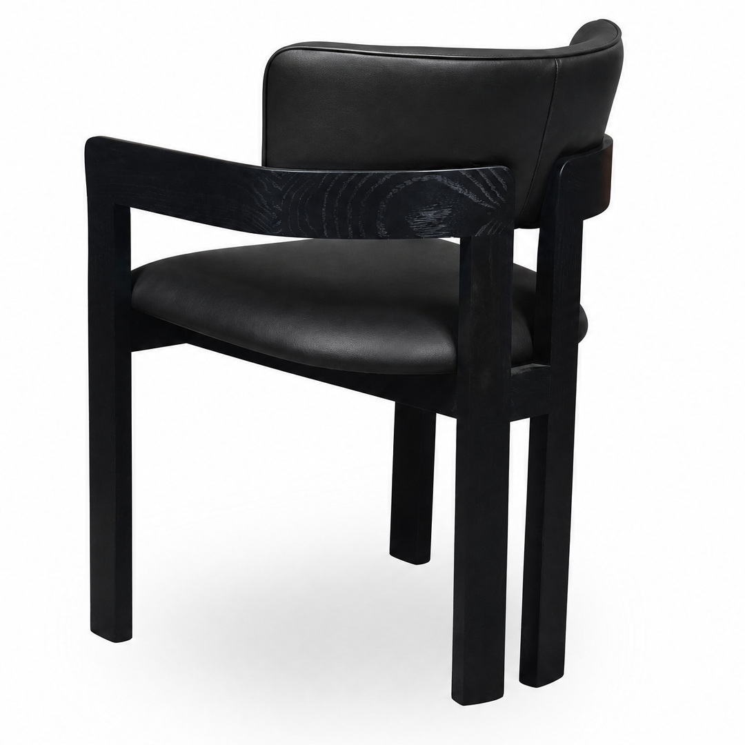 Black leather Maison dining chair with a modern design, featuring a sleek frame and cushioned seat for comfortable dining.