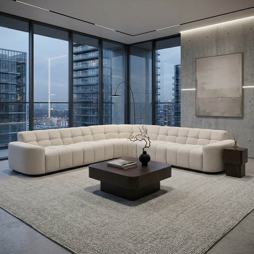 Light beige Adriano corner sofa with plush cushions and modern design, ideal for a cozy living room setting.