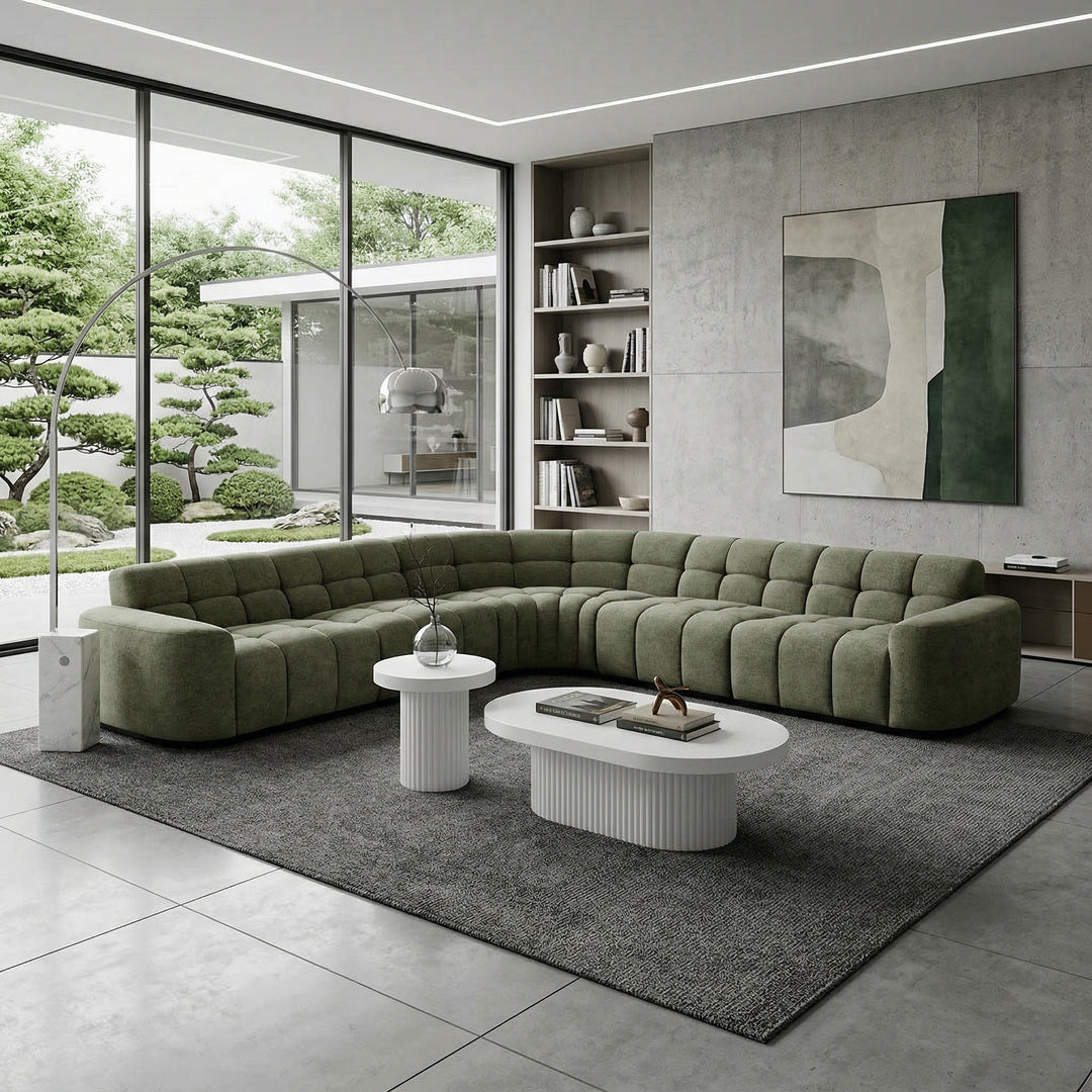 Moss green Adriano corner sofa with plush cushions, modern design, and fabric upholstery, shown in a cozy living room setting.