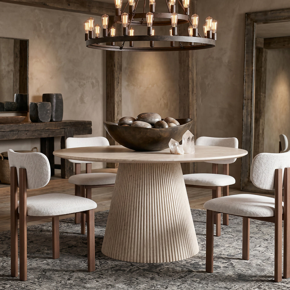 Round travertine Venice dining table with a 1.2m diameter, featuring a smooth surface and sturdy base for modern dining rooms.