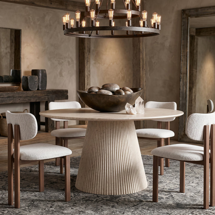 Round travertine Venice dining table with a 1.2m diameter, featuring a smooth surface and sturdy base for modern dining rooms.