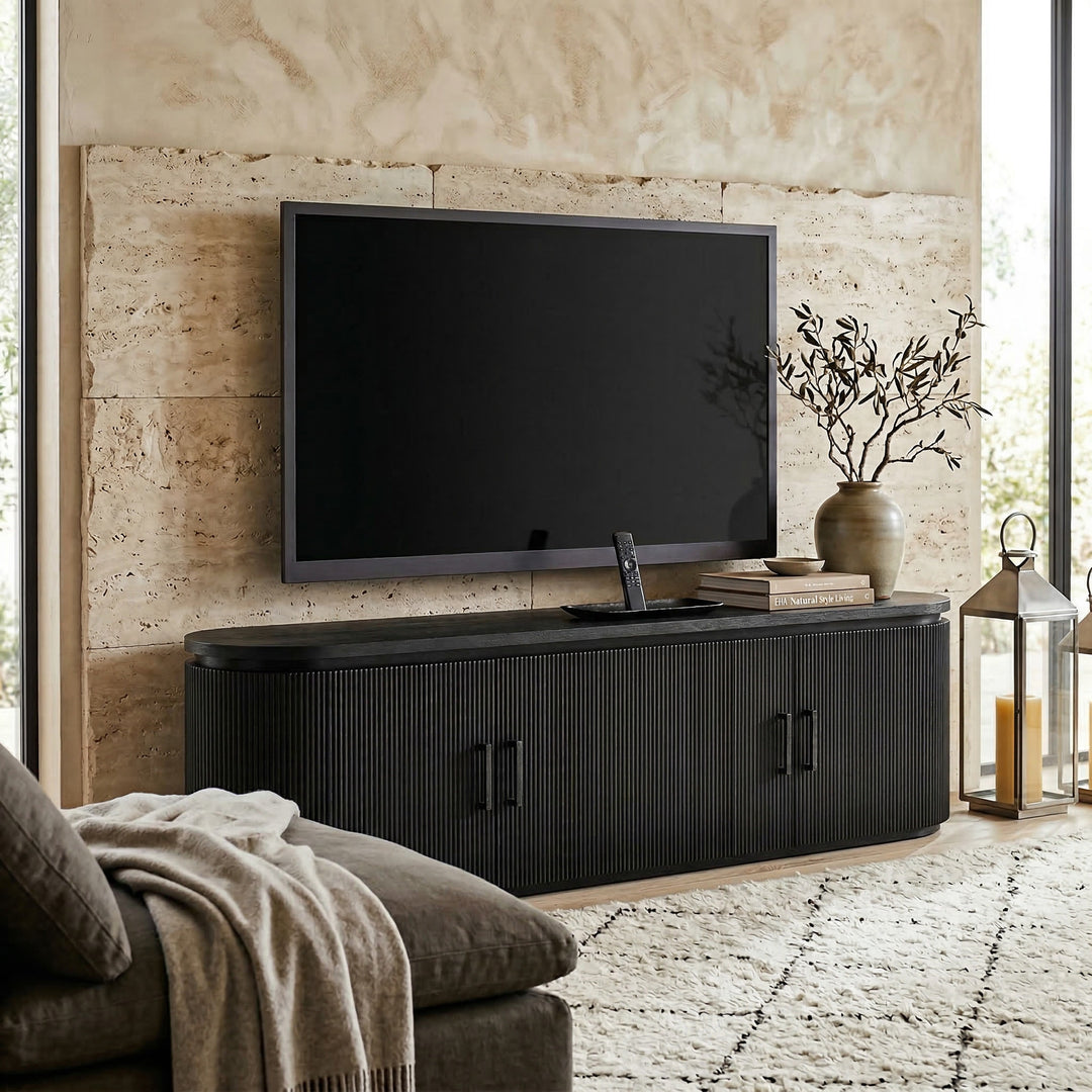 Modern Como TV unit placed against a wall with decorative accents, showcasing sleek design and storage space for entertainment setup.