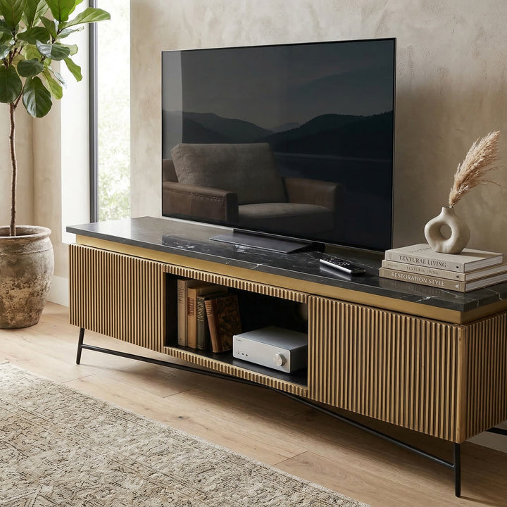 Modern Glamour Entertainment Unit placed against a wall with decorative accents, showcasing sleek design and ample storage space.