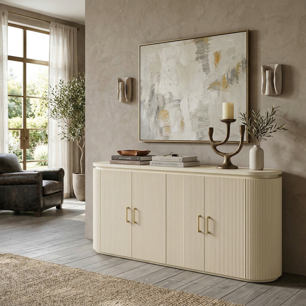 Buffet sideboard with a modern design, featuring a light wood finish and sleek handles, placed against a wall with decorative accents.