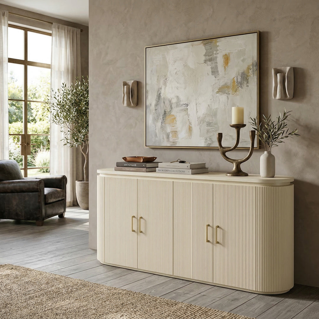 Buffet sideboard with a modern design, featuring a light wood finish and sleek handles, placed against a wall with decorative accents.
