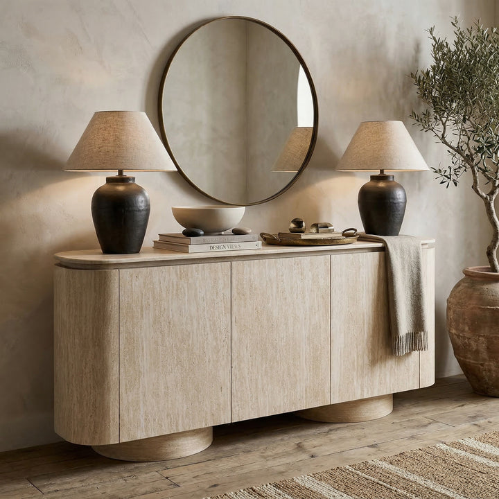 Travel-inspired Palm Springs sideboard buffet with travertine finish, shown against a wall in a modern interior setting.