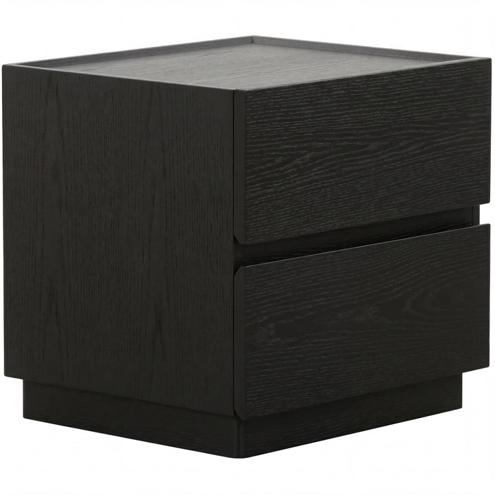 Black oak Madrid bedside table with a sleek, modern design, featuring a smooth surface and minimalist drawer handle.