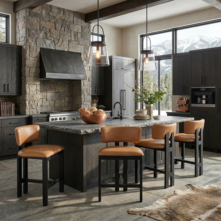 Modern Italian-style tan leather Modenese bar stool with sleek design and wooden legs, perfect for contemporary kitchen or bar area.