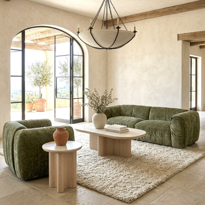 Two-seater Aurora sofa in neutral fabric, showcasing plush cushions and modern design, paired with a matching chair.