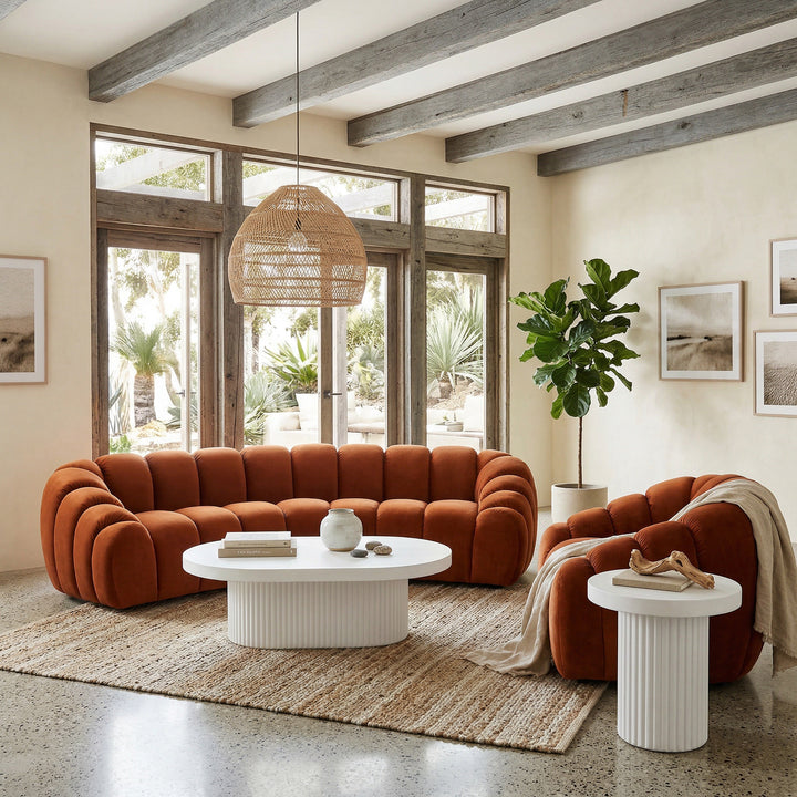 Bondi Side Table next to a sofa and chair, showcasing a modern side table with a sleek design and wooden finish.