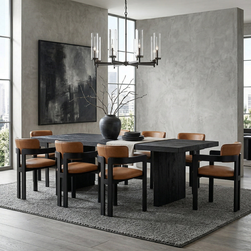 Tan leather Maison dining chair with a sleek, modern design featuring a curved backrest and wooden legs in a dining room setting.