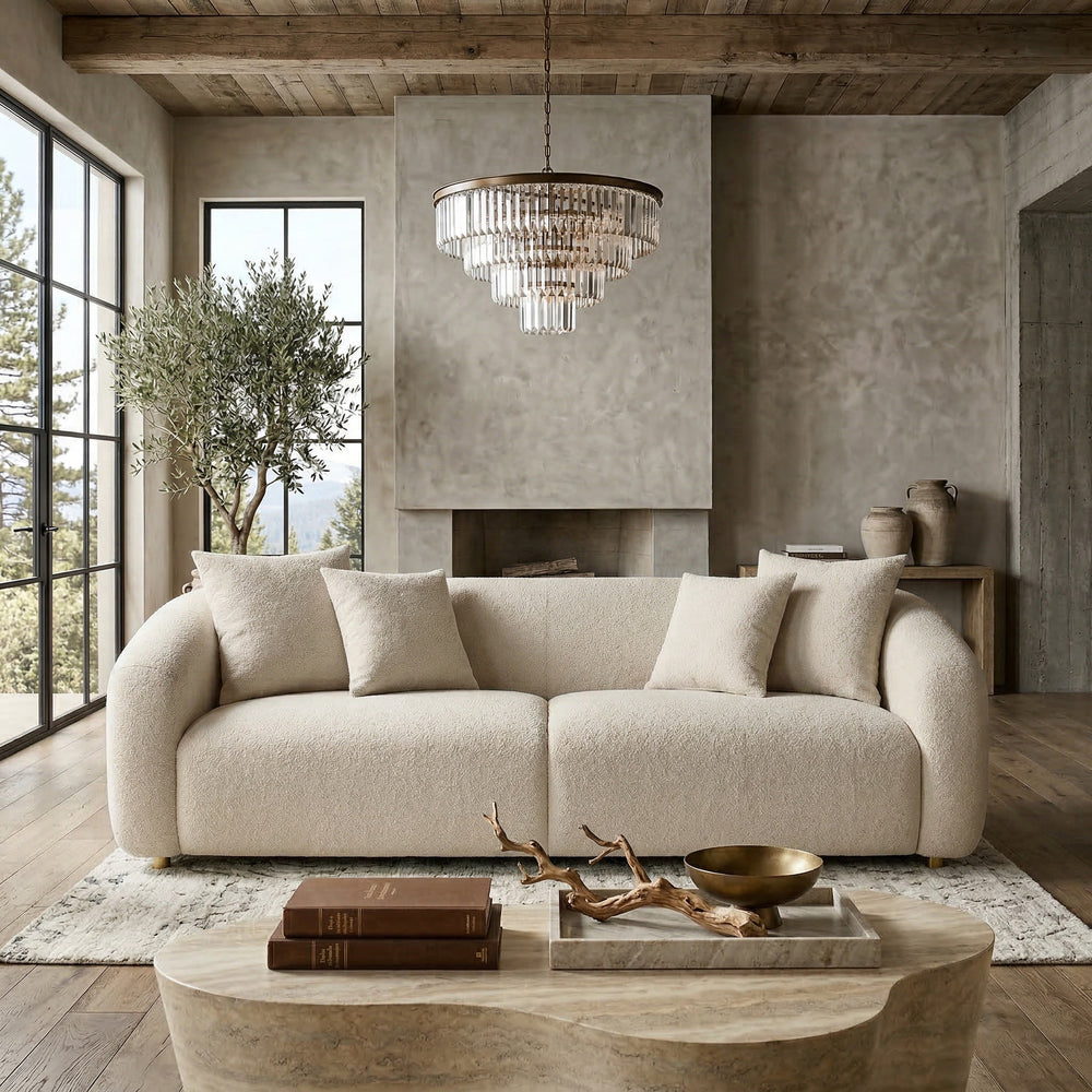 Modern Petra 2 Seater Sofa in neutral fabric, shown with matching chair in a contemporary living room setting.