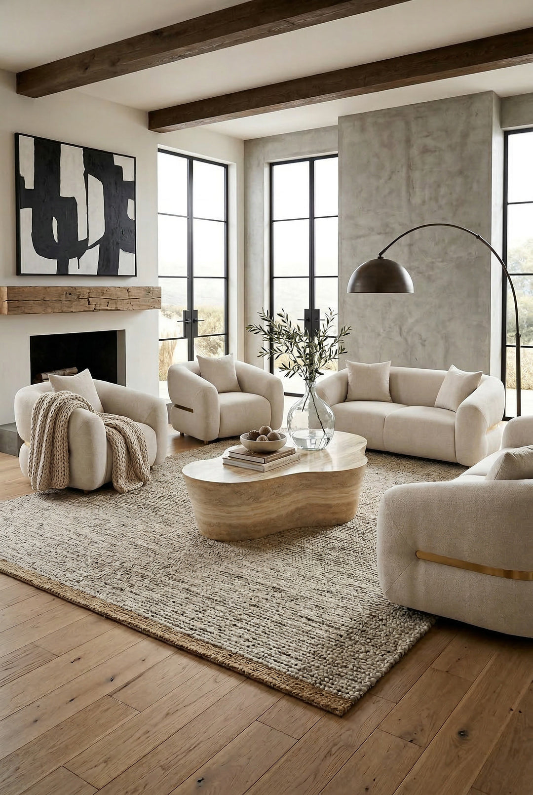 Modern Petra 2 seater sofa with clean lines and neutral fabric, paired with a matching chair in a contemporary living room setting.