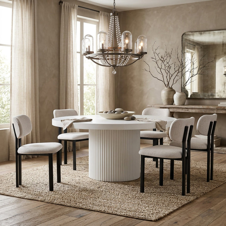 Beige Farinelli dining chair with a sleek design, shown next to a round white dining table for modern home dining setup