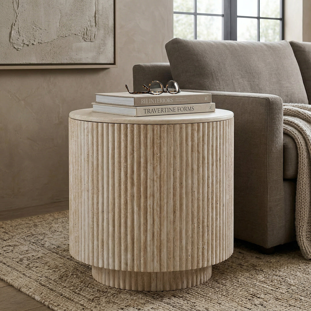 Velvet beige Venice side table with round top and slender legs, perfect for a modern living room.