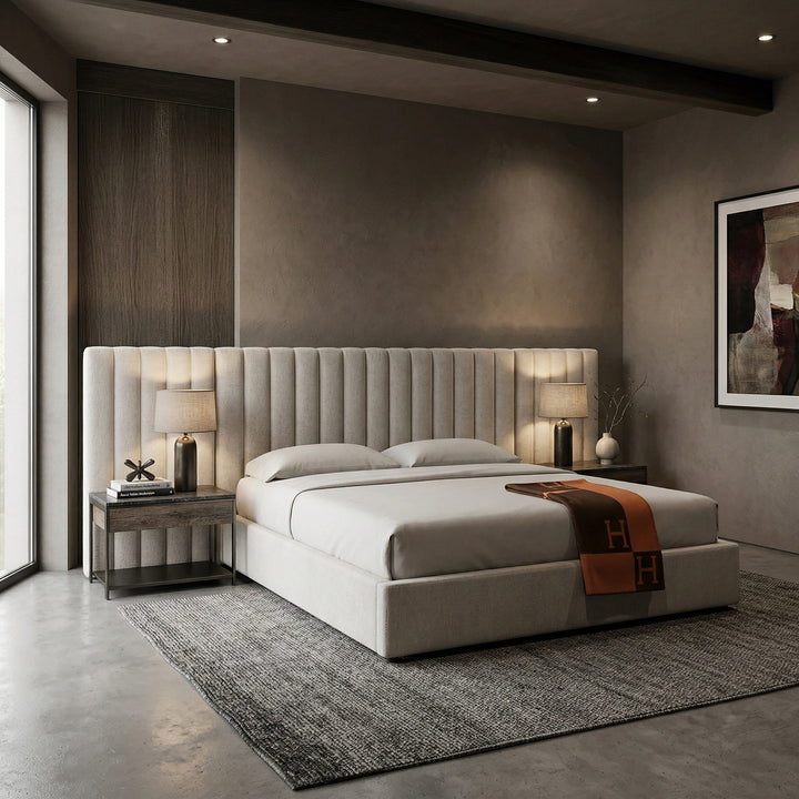 Beige Corsica king bed with padded headboard in a stylish bedroom setting, featuring side tables and cozy decor.
