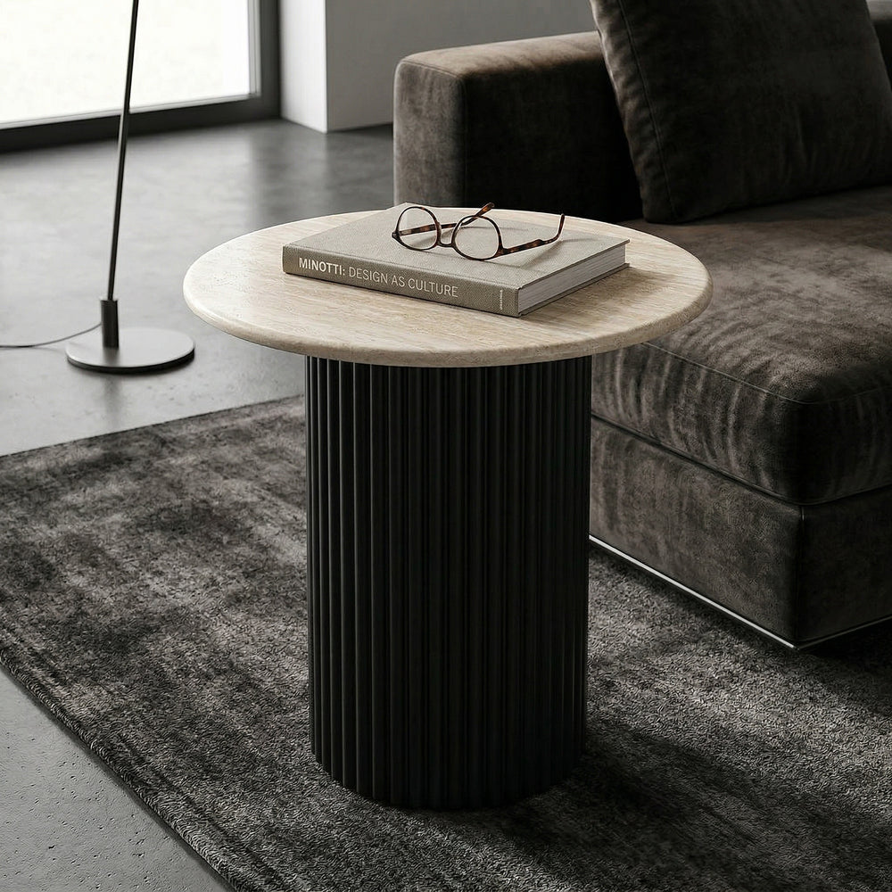 Noosa side table in a modern living room setting, featuring a sleek design with a round top and minimalist style.