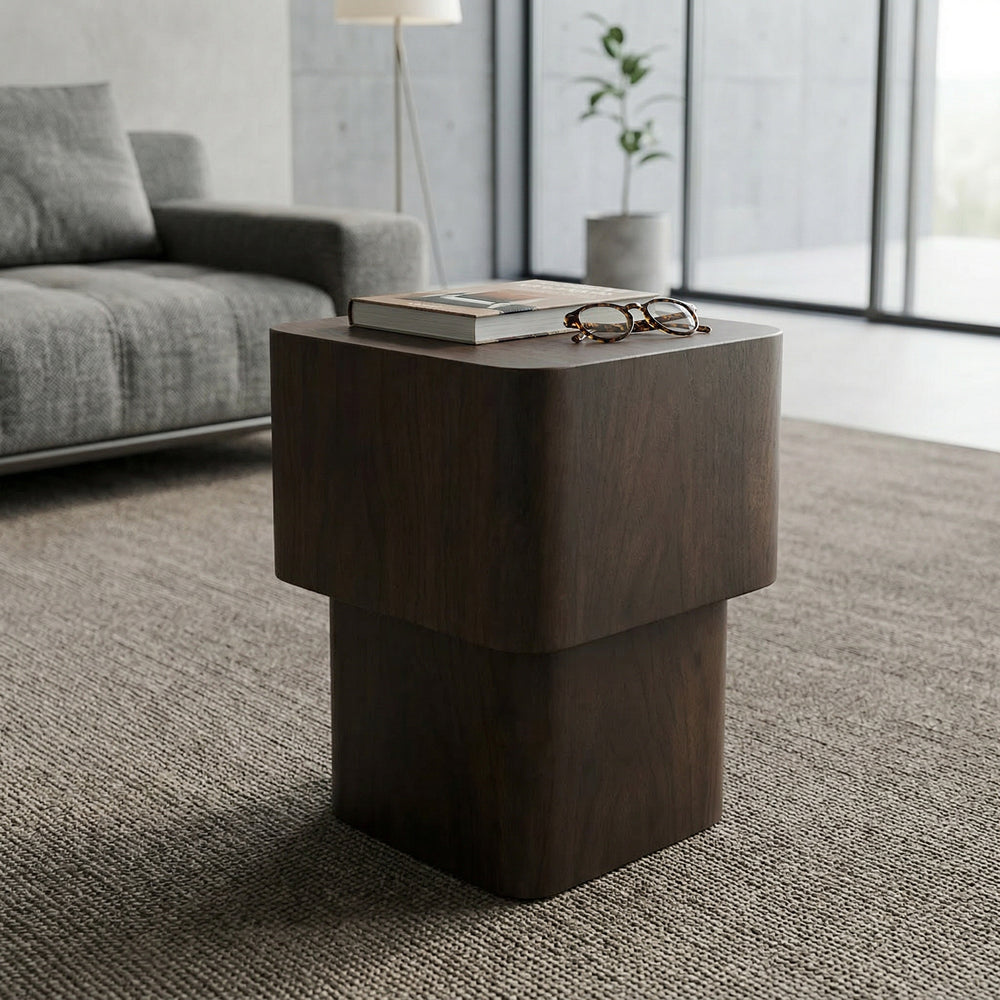 Nano banana Piazza side table in a living room setting, showcasing its sleek design and compact surface for modern decor.