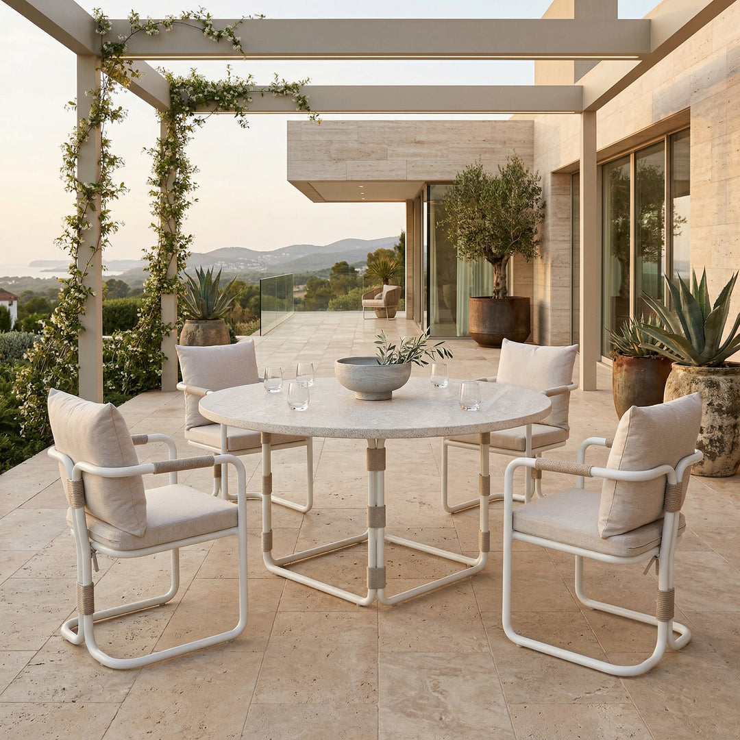 Fiore 1.5m round creme dining table with a smooth surface, shown with matching dining chairs for a modern dining room setup.