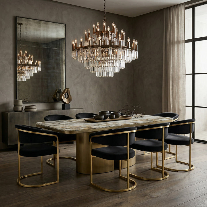 Black velvet Gianna dining chair with sleek, modern design, featuring a comfortable cushioned seat and stylish tapered legs.